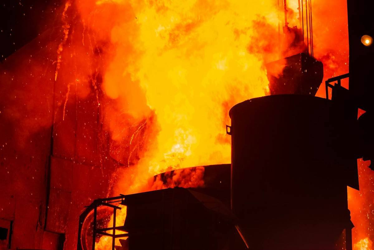 Scenic molten iron and sparks in steel plant